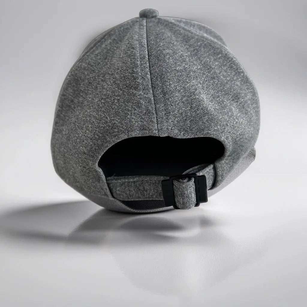 Premium grey cap with adjustable strap and breathable fabric.