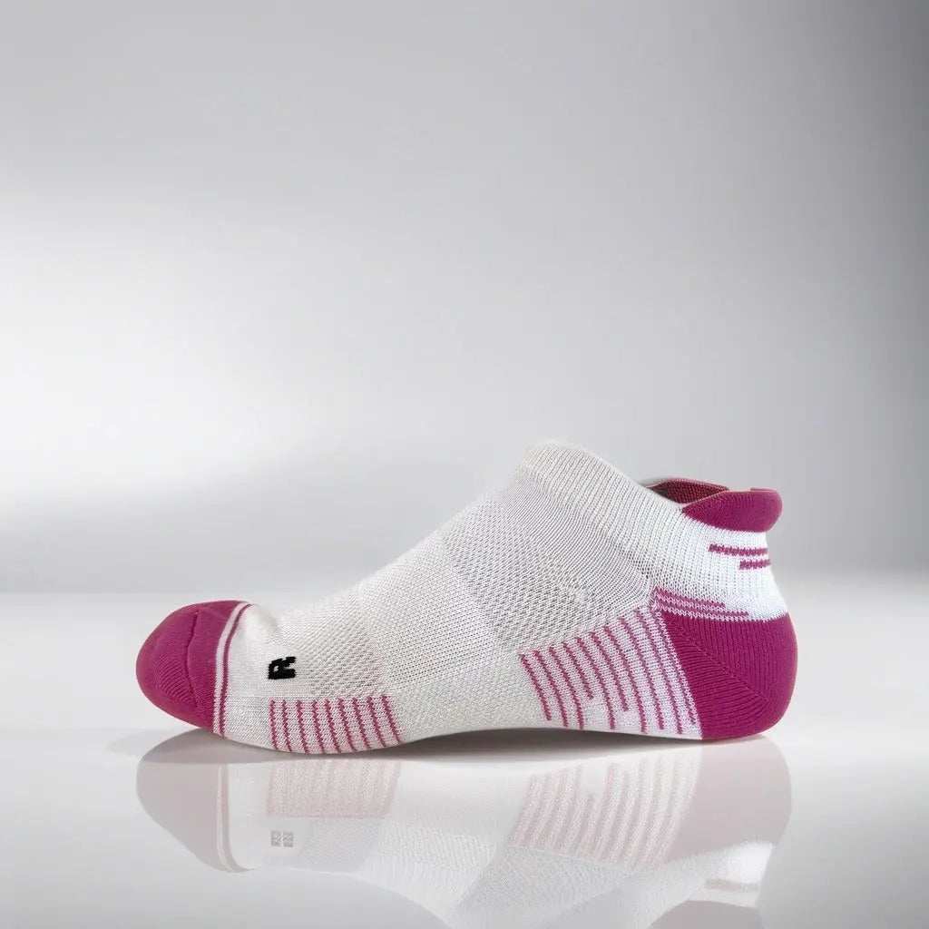 low-cut white and pink tennis socks with breathable mesh and secure fit strip designed for summer performance